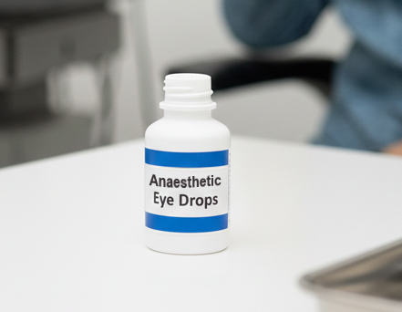 Anaesthetic eye drops to numb the eye.